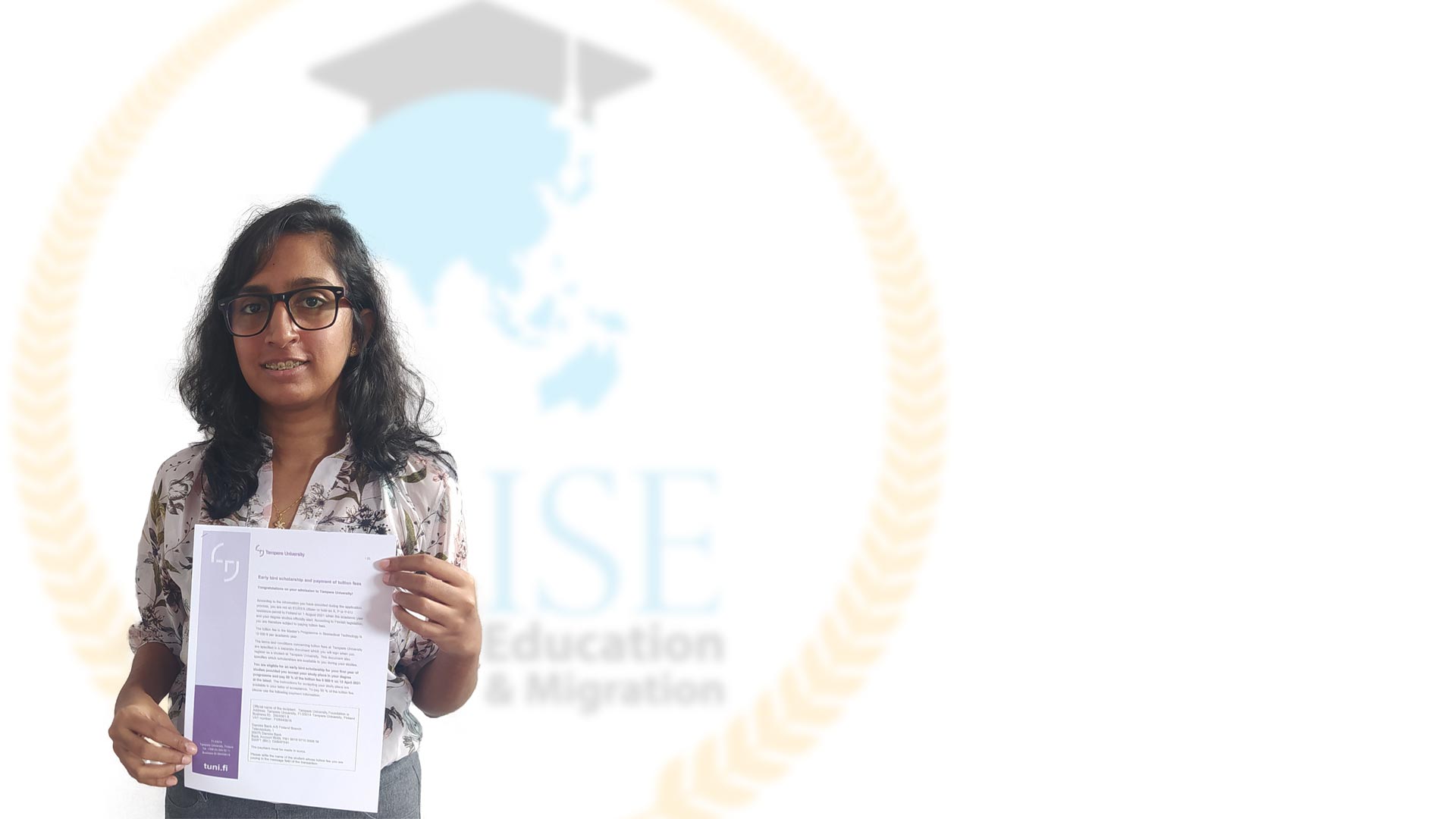 Harini receiving her resident visa from Wise Education